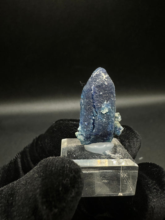 Fully terminated deep blue indigo Afghanite crystal from Sar-e-Sang, Afghanistan, side view