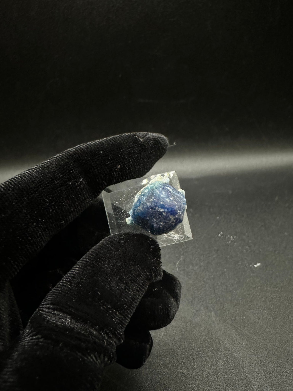 Fully terminated deep blue indigo Afghanite crystal from Sar-e-Sang, Afghanistan, angled view
