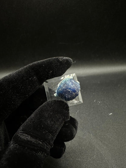Fully terminated deep blue indigo Afghanite crystal from Sar-e-Sang, Afghanistan, angled view