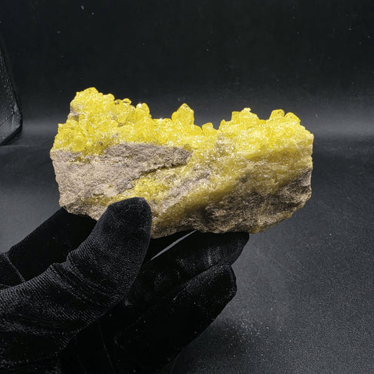 Bright yellow native sulfur crystal cluster on matrix from Peru