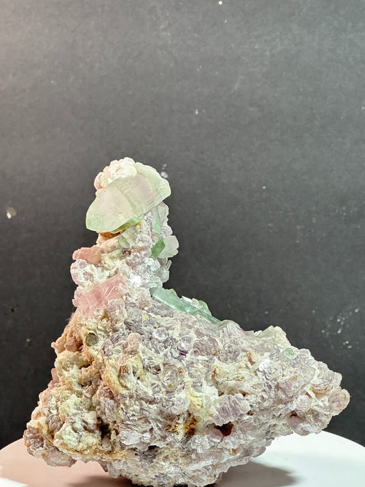 Duck-shaped pink and green tourmaline with terminated quartz crystal on matrix, Pakistan